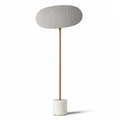 Floor lamp with fabric shade and marble base in gold and gray finish